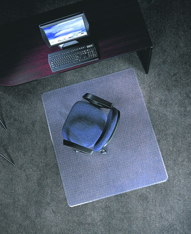 Clear vinyl chair mat under an office chair on carpet