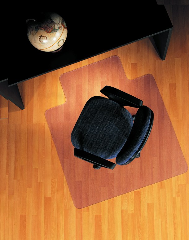 Clear vinyl chair mat under an office chair on hard wood floor